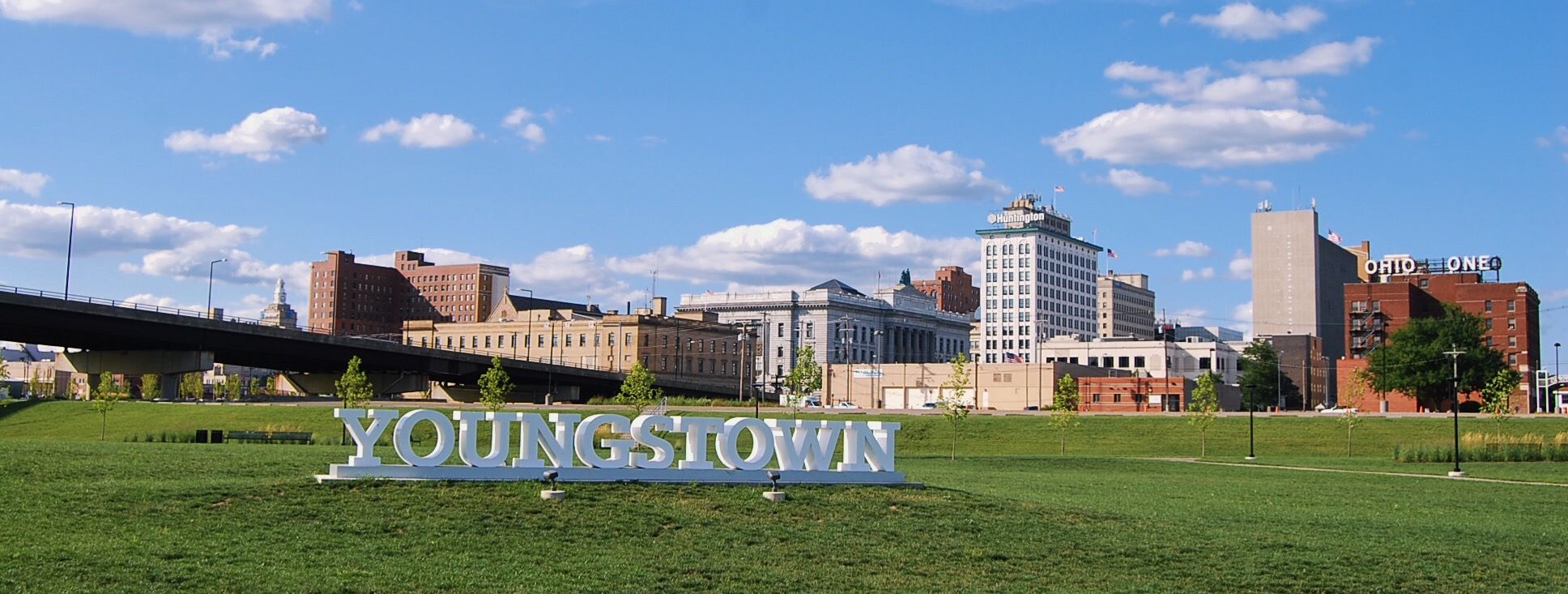The YOUNGSTOWN sign at Wean Park with the downtown skyline behind it.